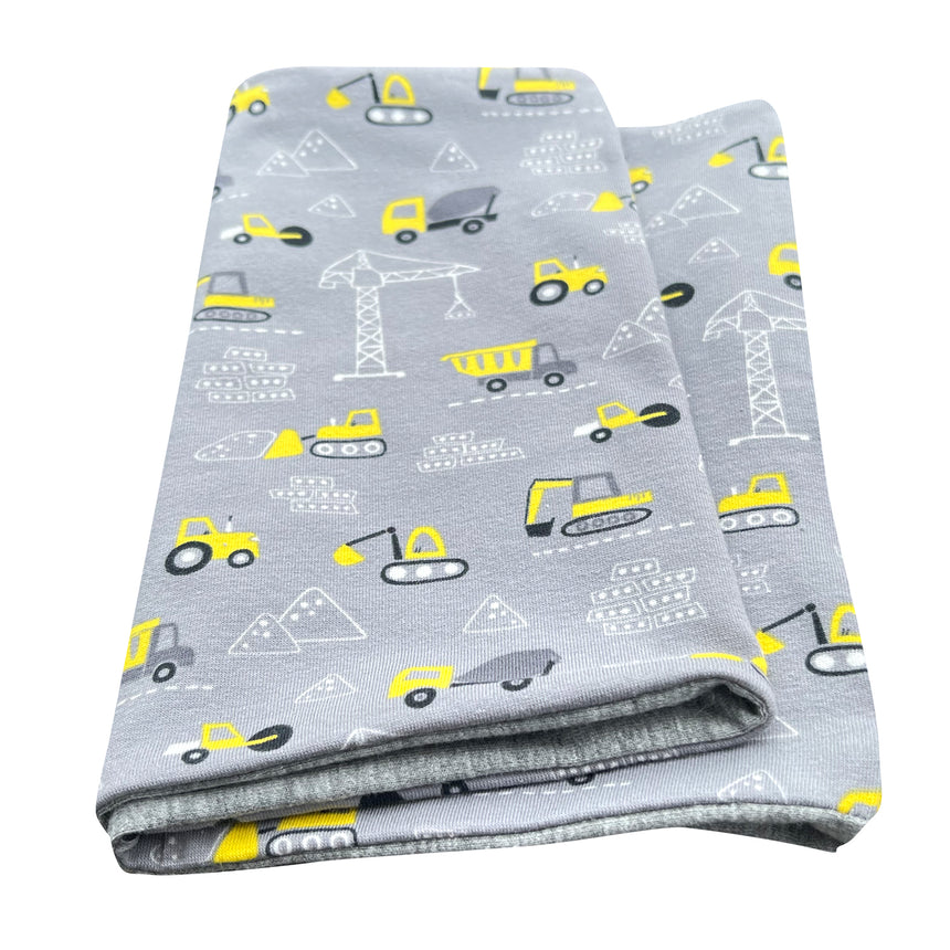 Wollhuhn Leichtes Öko Jersey Halstuch mit Bagger-Muster, handgemacht in Hellgrau und Gelb, locker und wendbar, ideal für Kinder in Übergangszeiten.