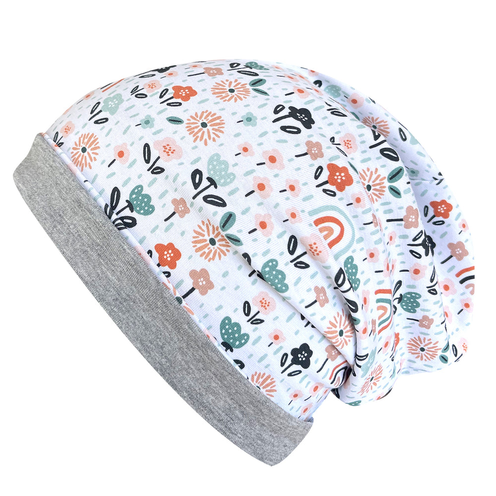 Wollhuhn Öko Long Beanie mit Blumenmuster, zweilagig, aus weichem Baumwolljersey, bequem und wendbar, handgefertigt in Deutschland für ganzjähriges Tragen.
