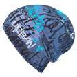Wollhuhn Öko Shorties: Handgemachte, zweilagige blaue Beanie mit Graffiti-Design, ideal für Kinder und Teenager. Bequem, wärmend, wendbar und unter Helmen tragbar.