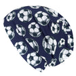 Wollhuhn Öko Shorties Wendemütze, zweilagig, Fußballmuster. Handgenäht, bequem, ideal für aktive Kinder. Hochwertiger Öko-Jersey, flexibel und mitwachsend.