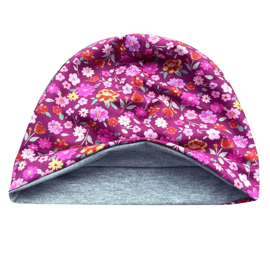 Wollhuhn Öko Shorties: Handgemachte, zweilagige Beanie mit Blumenmotiv, ideal für Kinder. Leicht, dehnbar und wendbar, perfekt für aktive Abenteuer.