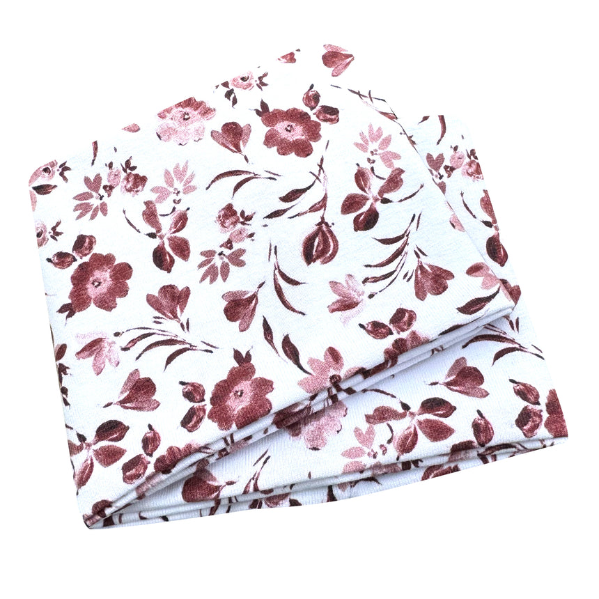 Wollhuhn Elastisches Öko Stirnband, zweilagig, aus Jersey, mit weiß-altrosa Blumenmuster, handgemacht in Deutschland, weich und vielseitig tragbar.