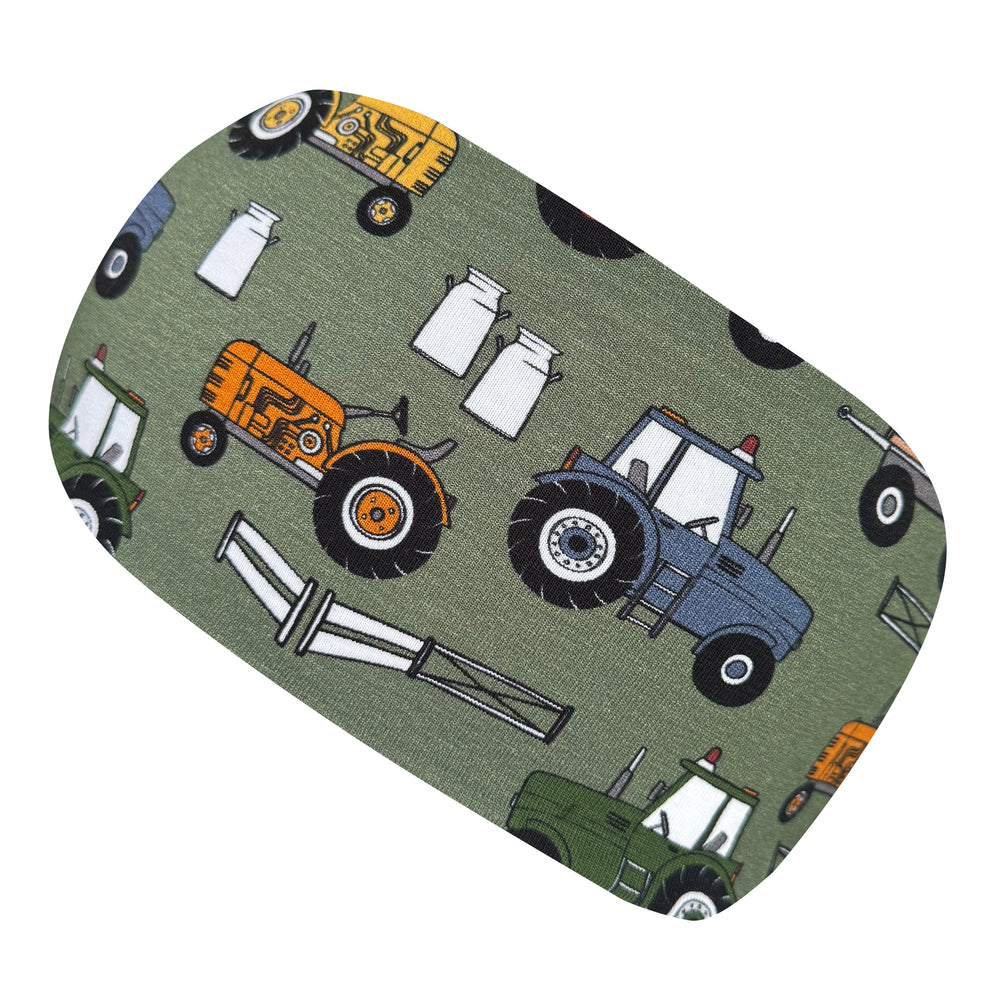 Wollhuhn Elastisches Öko Stirnband, zweilagig und breit, mit Traktor-Motiv. Handgefertigt aus Bio-Baumwolle, ideal für Sport und Freizeit, passt Kindern und Erwachsenen.