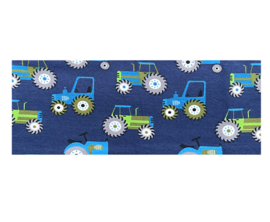 Wollhuhn Elastisches Öko Stirnband/Haarband Jersey Zweilagig Breit Traktor/Trecker Dunkelblau, handgefertigt aus weicher Bio-Baumwolle mit Traktormuster auf blauem Stoff, ideal für Outdoor-Aktivitäten.