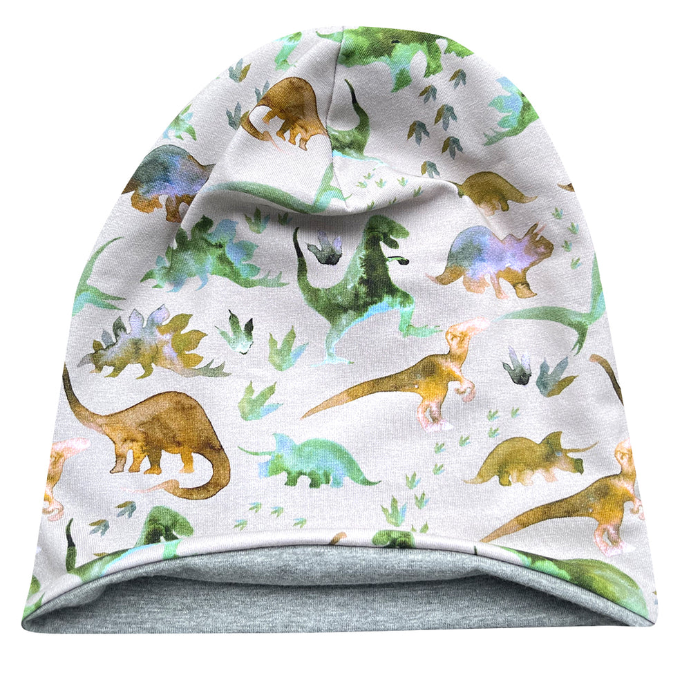 Wollhuhn Öko Long Beanie mit Dinosaurier-Muster, aus weichem Baumwolljersey, zweilagig und wendbar, ideal für Kinder, handgefertigt in Deutschland.