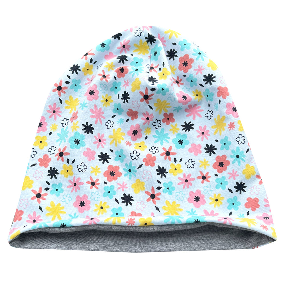 Wollhuhn Öko Long Beanie / Wendemütze, zweilagig, mit floralem Muster in Pastelltönen. Handgefertigt, weich, formbeständig, ideal für Kinder, wendbar mit grauer Innenseite.
