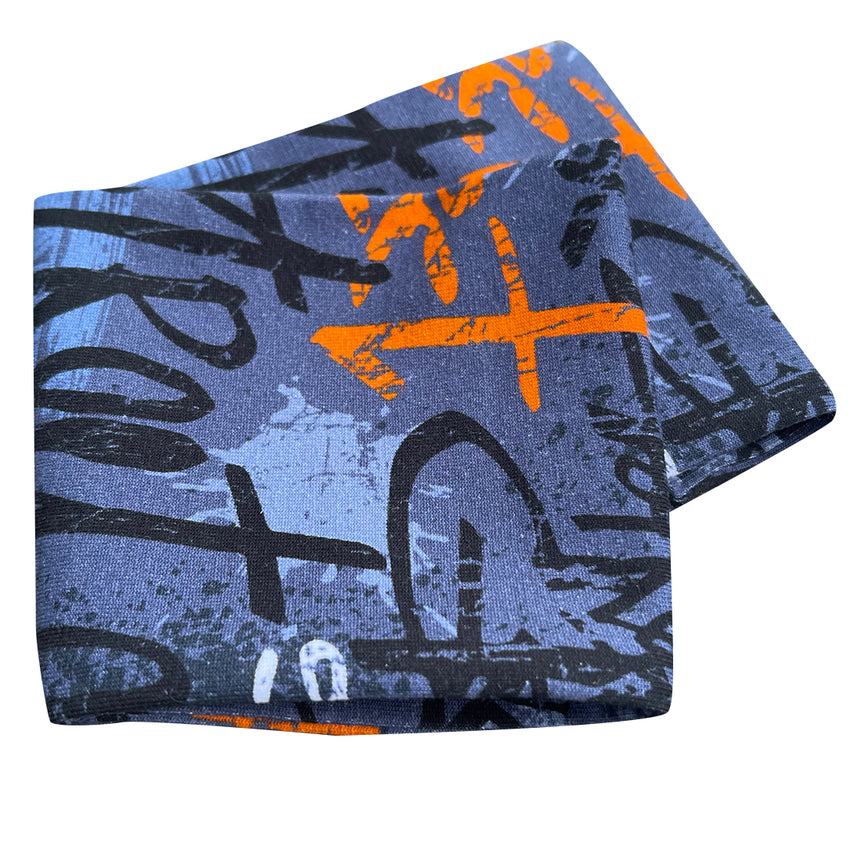 Wollhuhn Elastisches Öko Stirnband aus doppellagigem Jersey, handgemacht in Blau mit schwarzen und orangefarbenen Aquarellsprenkeln, ideal für Sport und Alltag.