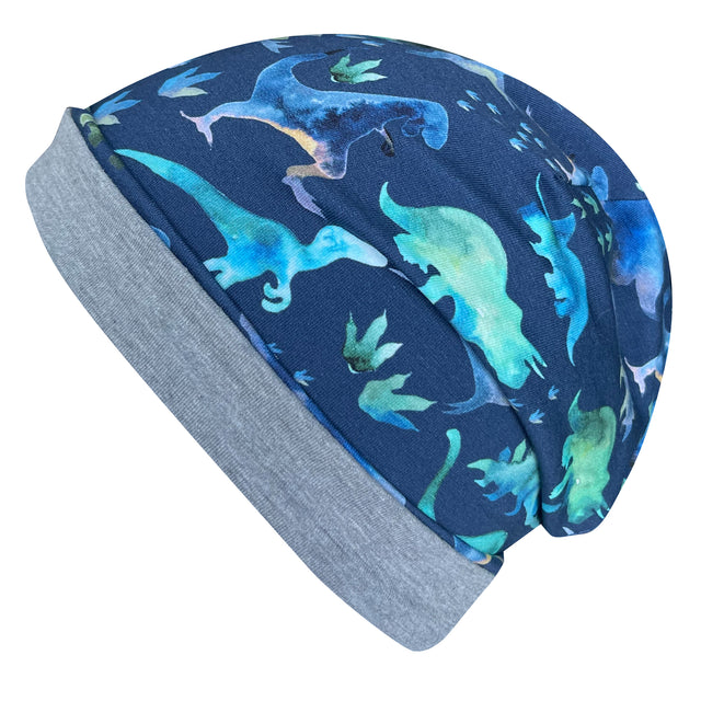 Wollhuhn Öko Long Beanie, wendbar, zweilagig, mit blauen Dinosauriermotiven. Aus weichem, dehnbarem Jersey, ideal für das ganze Jahr.