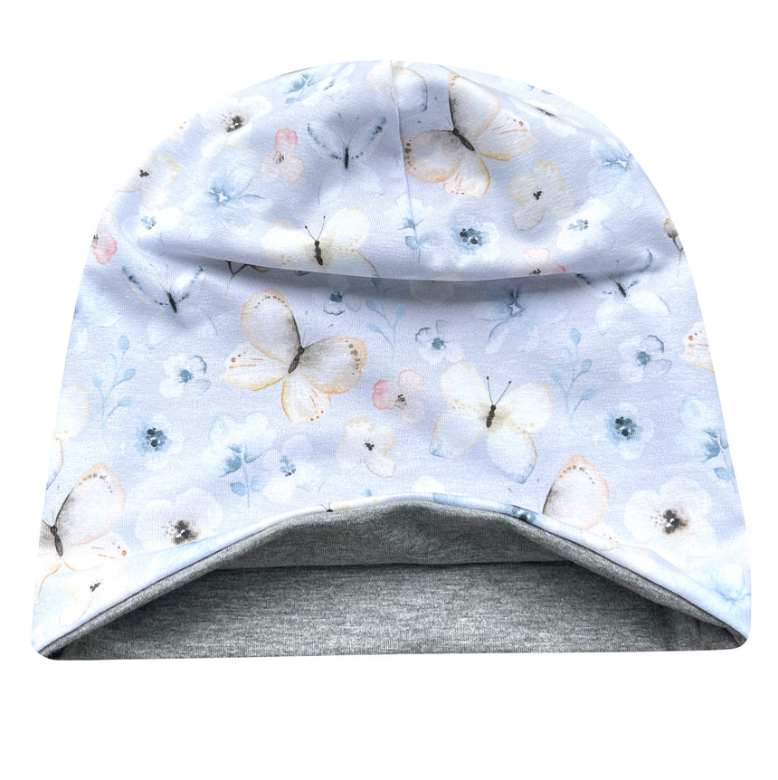 Wollhuhn Öko Long Beanie, eine zweilagige, wendbare Mütze aus weichem Baumwolljersey, mit Blumenmuster, ideal für Kinder, hält zuverlässig warm.