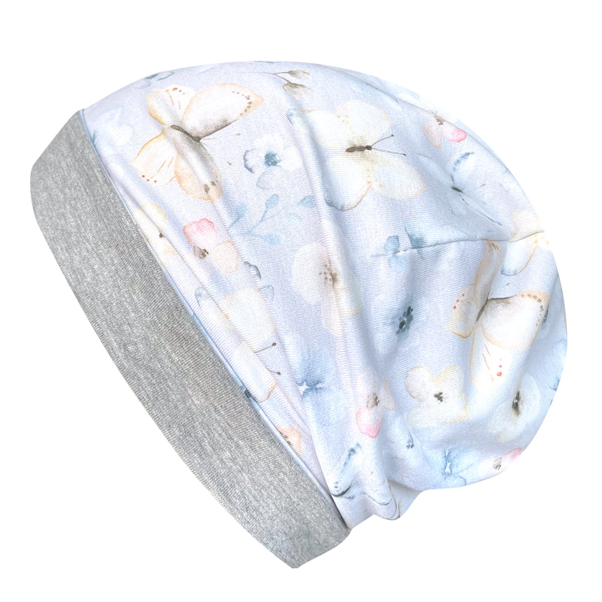 Wollhuhn Öko Long Beanie / Wendemütze mit Blumen- und Schmetterlingsmuster, aus weichem Baumwolljersey, zweilagig, ideal für Kinder, handgefertigt in Deutschland.