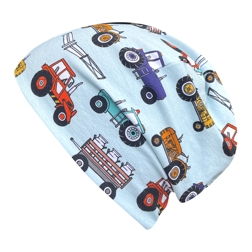 Wollhuhn Öko Shorties: Handgemachte Wendemütze mit Traktormuster, doppellagig, ideal für aktive Kinder, passt unter Helme, bequem und stilvoll für jedes Wetter.