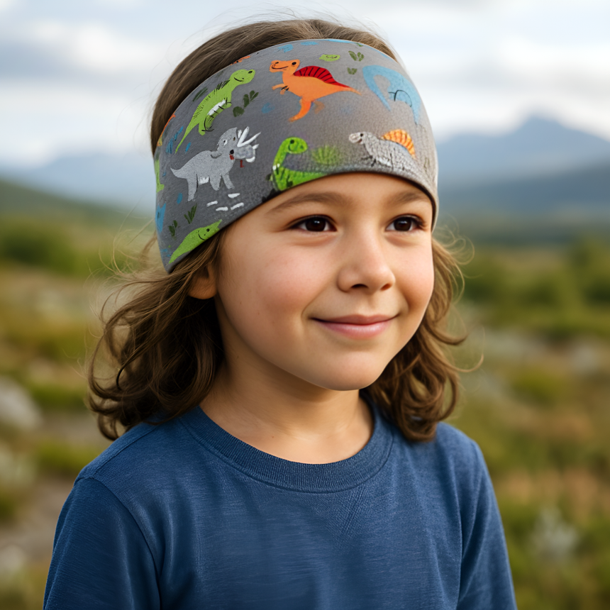 Kind mit Wollhuhn Elastisches Öko Stirnband, Jersey, zweilagig, breit, mit Dinosaurier-Motiv, handgemacht in Deutschland, aus weicher, dehnbarer Bio-Baumwolle.