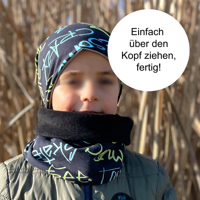 Wollhuhn Halstuch / Schlupfschal / Loop WARM, Innen Fleece, getragen von einer Person mit Mütze, ideal für kühle Tage, handgefertigt und bequem.