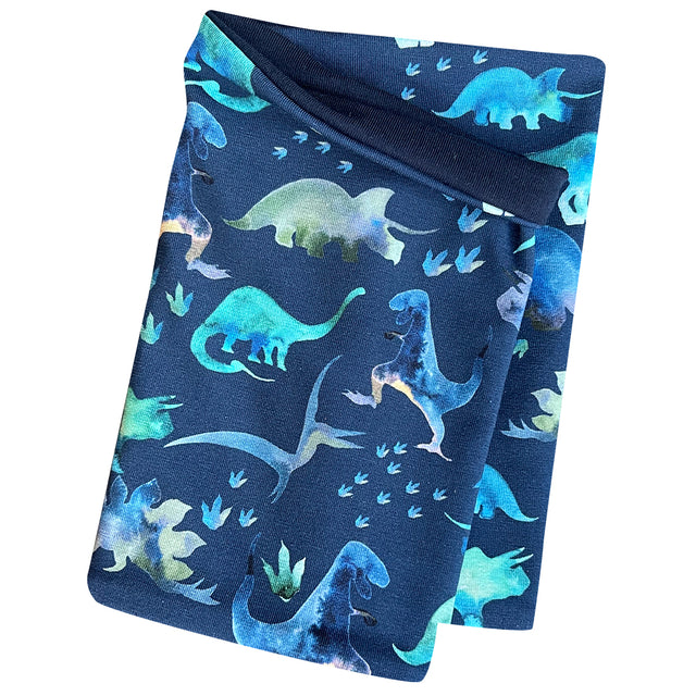 Wollhuhn Leichtes Öko Jersey Halstuch Dinos Blau, handgemachter Schlupfschal mit blauem Dinosauriermuster auf hochwertigem Jersey, ideal für Kinder in Übergangsjahreszeiten.